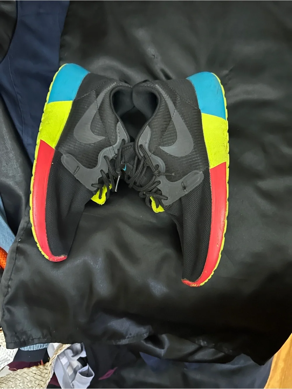 Nike Black Sneakers with Blue, Yellow and Pink Sole Accents